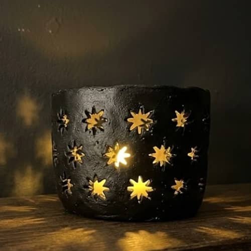5. Starburst Cutout Clay Lantern